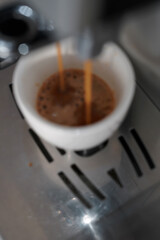Abstract View of Making Espresso Coffee Process. Pouring Fresh Coffee Stream from Coffee Machine.