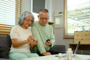 Fototapeta premium Mature couple having online medical consultation with doctor on laptop. Telehealth concept