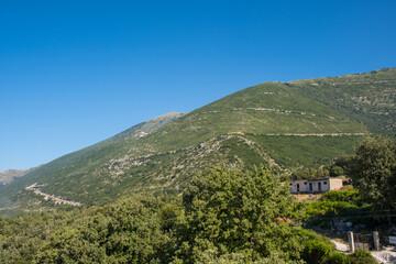The mountain road across the Llogara pass in Albania - 805101235