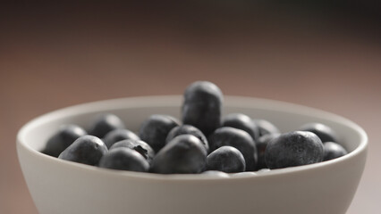 fresh blueberries in a white bowl closeup