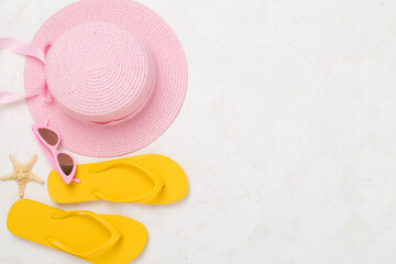 Flat lay with colorful beach accessories on concrete background. Vacation concept