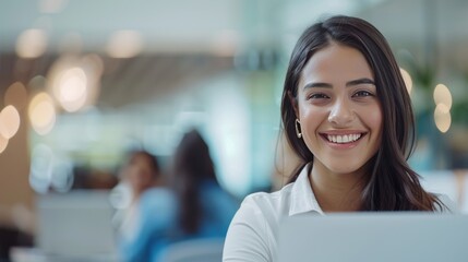 Portrait of Beautiful Young Hispanic Female Smiling in an Office Business Environment - Powered by Adobe