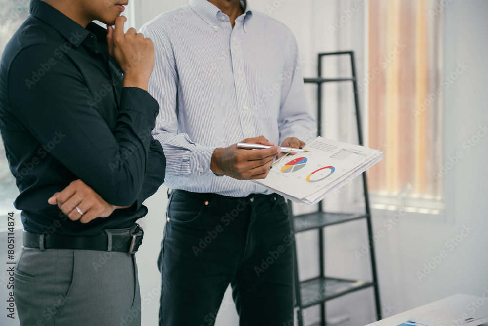 Aufkleber two men are standing in front of a white board with a pie chart on it