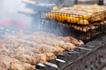 Many kebabs are prepared on the grill. Street food.