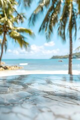 Beautiful marble table top with a blurred beach and palm trees background for product display montage
