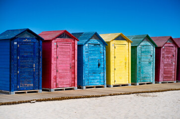Colorful beach huts on a clear day, on the Mediterranean Sea