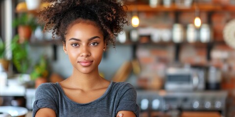 Woman Standing in Kitchen With Arms Crossed