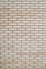 Vertical yellow and textured brick wall background 