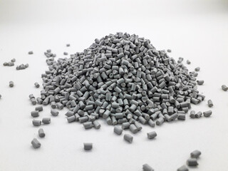 gray low density polyethylene masterbatch granules on a white background, this polymer is a colorant for products in the plastics industry