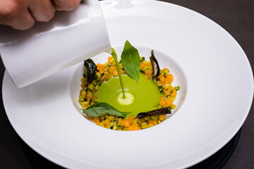 hand holding a plate with a fork