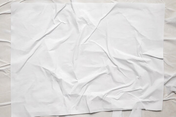 white crumpled and creased glued wrinkled paper poster texture background