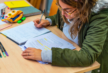 Focused Academic Pursuit: Student Engrossed in Library Study