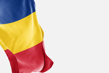 National flag of Romania flutters in the wind. Wavy Romania Flag. Close-up front view.