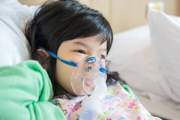 Sick little asian girl inhalation with nebulizer for respiratory treatment - obrazy, fototapety, plakaty