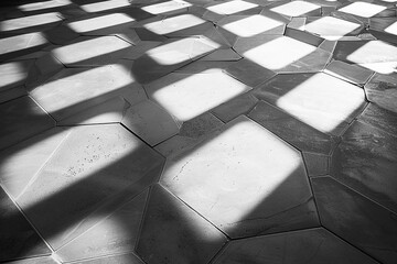 Hexagonal shadows stretching across a minimalist grayscale canvas, creating a captivating interplay of light and shadow