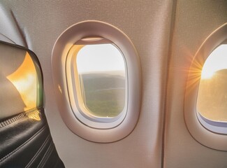 Airplane window on the air. Travel by plane concept.