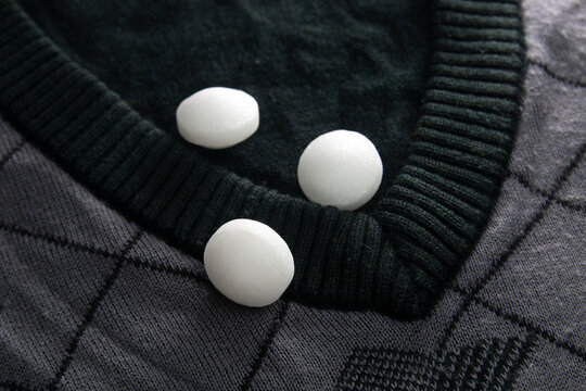 White naphthalene balls on cloth.