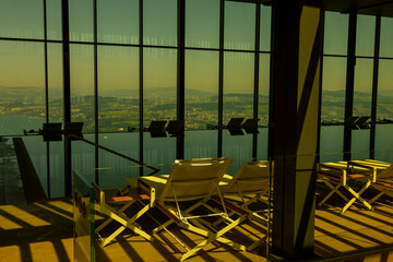 Infinity Swimming Pool with Window View over City and Lake Lucerne in Sunny Day in Lucerne, Switzerland.