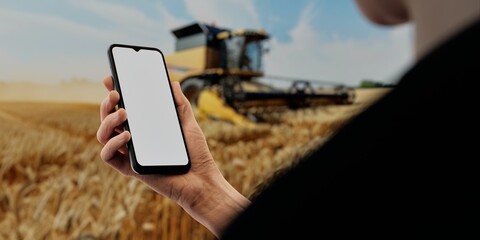 Hand with smartphone in wheat field, perfect for agricultural tech promotions