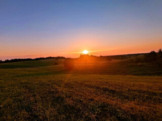 Fototapeta premium sunset over the field