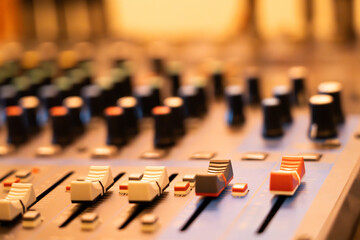 Close-up of the music mixer control panel. colorful buttons The background uses a blurring technique