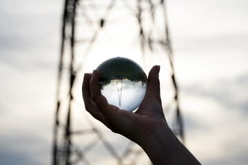 Crystal Sphere. Crystal Sphere, used for meditation, clairvoyance, health, luck and abundance! Hands covering the crystal sphere. Day photo. Crystal sphere in various angles.Various backgrounds. 