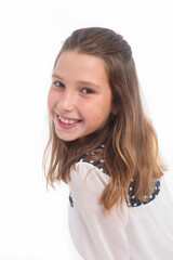 studio portrait of a cheerful preteen girl