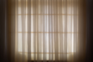 Blurred window and vintage tulle curtain background.