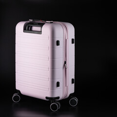 Carry-on suitcase on a black background