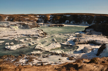 Fototapeta na wymiar Icelandic waterfalls in winter. Wide angle. 