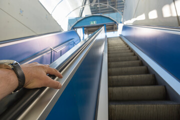 Personal Perspective of a Man Travel in a Escalator in switzerland.