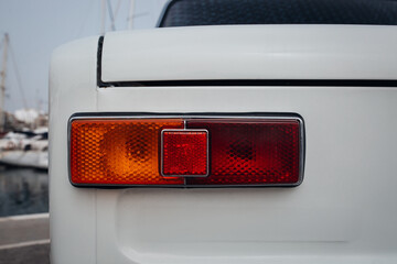 Old and classic car rear taillight close up