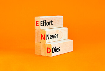 END effort never dies symbol. Concept words END effort never dies on beautiful wooden blocks....