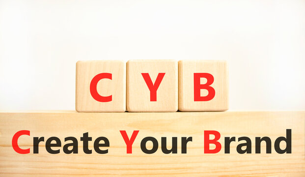CYB Create your brand symbol. Concept words CYB Create your brand on beautiful wooden blocks. Beautiful white background. Business CYB Create your brand concept. Copy space.
