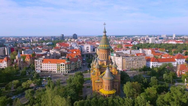 Aerial view of the beautiful city of Timisoara, Romania. Footage was shot from a drone at a higher altitude with the Mitropolitan Cathedral and The Victory Square in the view.
