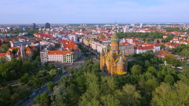 Aerial view of the beautiful city of Timisoara, Romania. Footage was shot from a drone at a higher altitude with the Mitropolitan Cathedral and The Victory Square in the view.