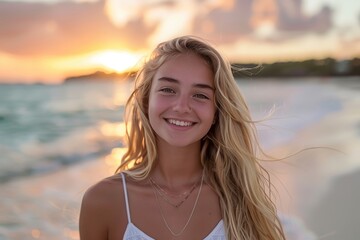 Beautiful blonde girl smiling on the beach