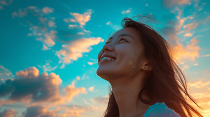 beautiful Asian woman smiles and looks at the sky, model girl posing for a fashion magazine,