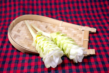 Edible Turmeric Flower on bamboo tray. Curcuma longa.