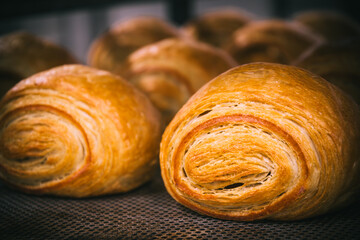 Freshly baked croissants on a baking sheet