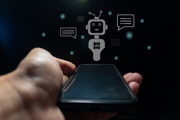 Hand holding a smart phone with virtual screen of artificial intelligence robot or chatbot technology concept.