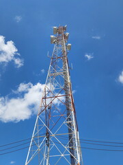 Radio communication antenna with Electrical wires passing through on  the sky background with...