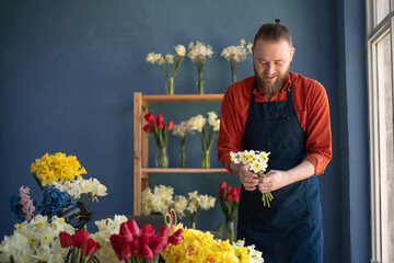 Florist making Beautiful bouquet of flowers for a gift. Present on 8 march and valentine's day.