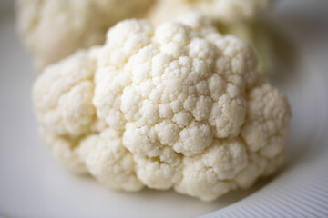 Close-up of a cauliflower. Chopped cauliflower. Healthy eating. Close up food photography. Fresh...