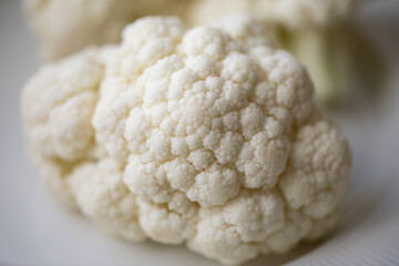 Close-up of a cauliflower. Chopped cauliflower. Healthy eating. Close up food photography. Fresh...