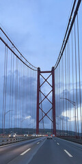 Obraz premium 25 April Bridge. Impressive engineering work over the river Tagus.
