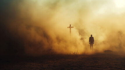 Silhouette of a man in the desert with a cross in the smoke and dust under light the sun, religion...