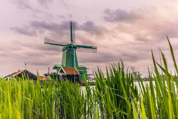 Old wooden windmills in the town of Zaanse Schans in the Netherlands