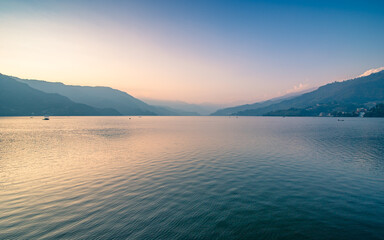 sunset over the Phewa lake in Pokhara, Nepal/