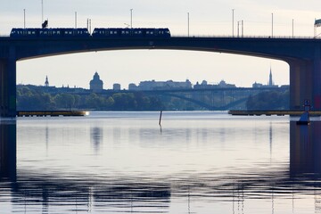 Summer day in Stockholm. Tram over the bridge between Bromma and Essingen in Stockholm